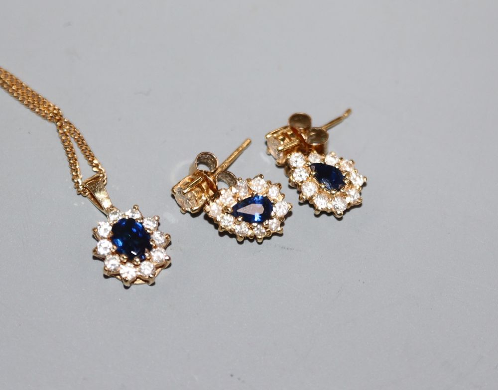 An 18ct gold, sapphire and diamond pendant on 18ct gold fine chain and a similar pair of earrings